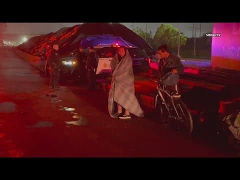 13 people rescued San Diego river swift stormwater