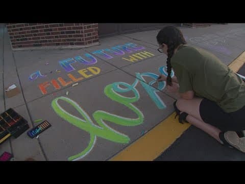 Chalk artist creates welcoming drawings for Annunciation students