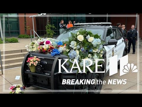 Makeshift memorial for Officer Jamal Mitchell begins at MPD 5th Precinct