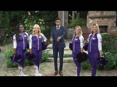 The Minnesota Viking's cheerleaders help Guy Brown with the Weather