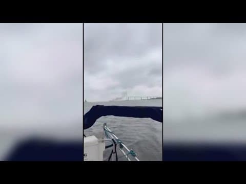 After an explosion, a ship caught on fire near Key Bridge in Baltimore