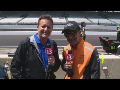 Tony Kanaan and Dave Calabro chat during Sonsio GP qualifying