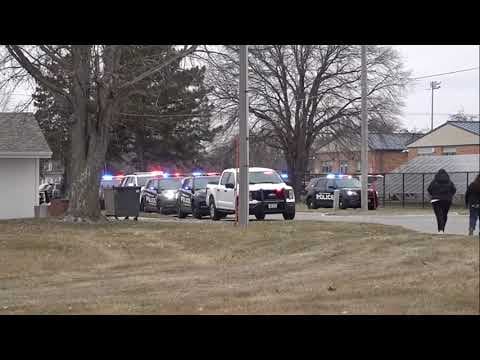 Police at the scene of a shooting at an Iowa high school