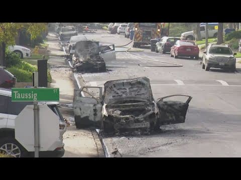 Residents react to the aftermath of a plane crash in a San Diego neighborhood