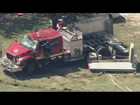 Two firefighters were injured in a rollover crash in rural North Texas