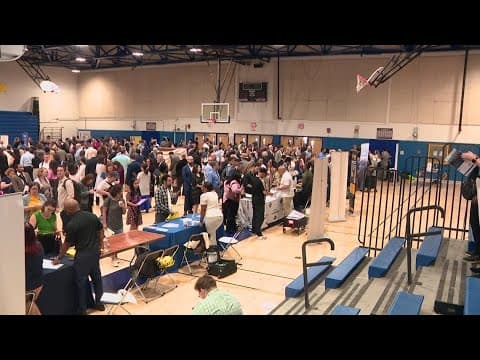 Thousands of fired federal workers flock to Alexandria job fair