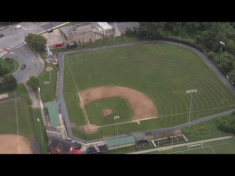 Firefighters charged after spraying baseball field with water hose