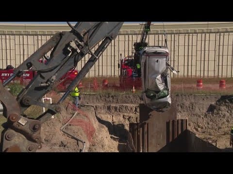 Video shows woman's car dive into 40-foot hole along Highway 290 in Cypress