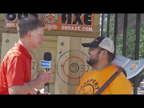Todd tries axe throwing at the Festival on the Fourth