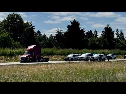 LIVE: Suspects in custody after barricading inside stolen semi on I-205