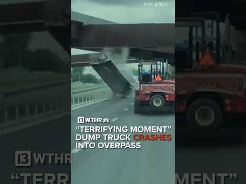 Dump truck crashes into overpass caught on camera