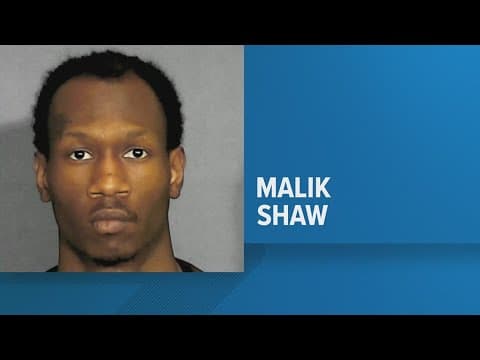 Man charged with Lawrence triple murder