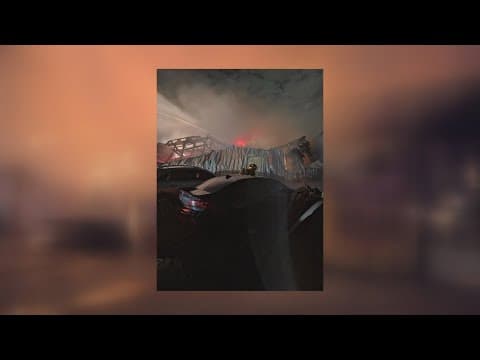 Two firefighters hospitalized after Harvey auto body shop fire