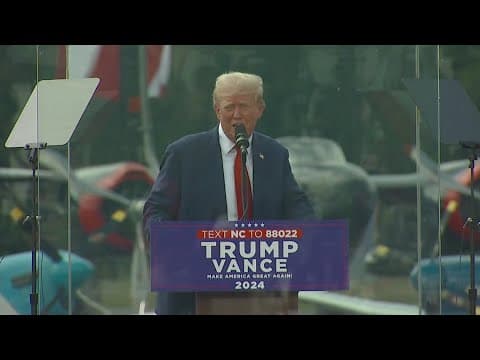 Donald Trump appears in first outdoor campaign event behind bulletproof glass since being shot