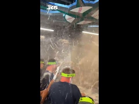 Champagne showers: Mariners celebrate after clinching playoff berth