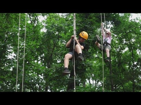 Cool Camps: Campers explore the woods with tree climbing