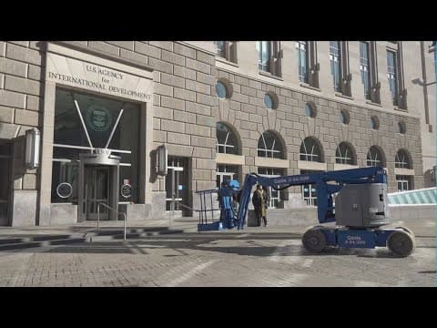 Signage for USAID taken down federal workers stare down deadline