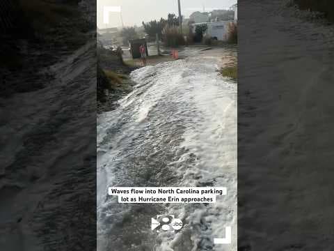 Waves flow into North Carolina parking lot as Hurricane Erin approaches