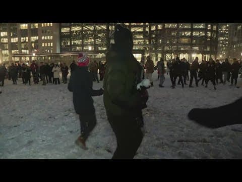 Adults get to be kids again with a snowball fight in Franklin Park