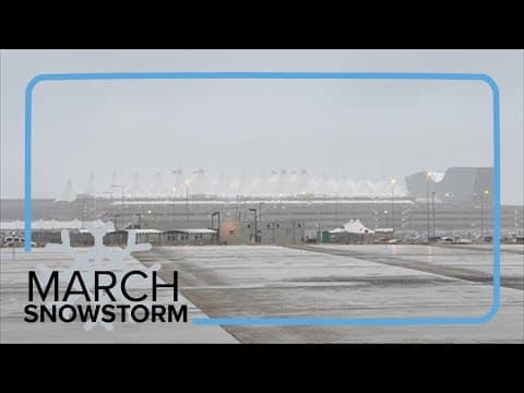 Why did Denver's airport only get a few inches of snow