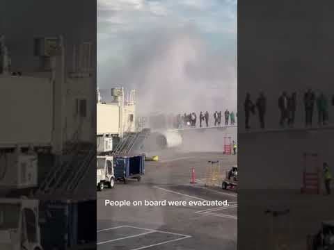 American Airlines plane catches fire at Denver airport