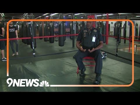 School resource officer teaching students through boxing