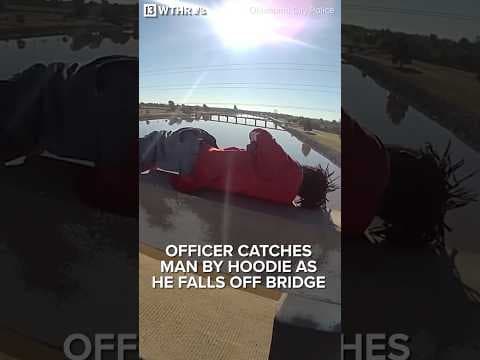 Officer catches man by hoodie as he falls off bridge