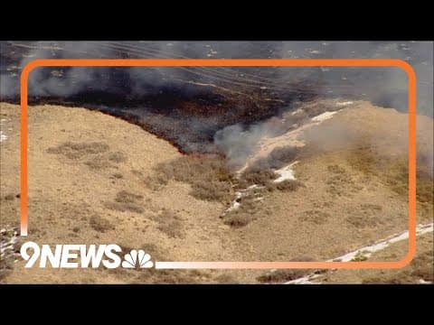 Crews mopping up grass fire in Douglas County