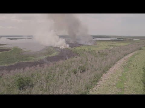 Bayou Sauvage fire still growing, crews open flood gates to saturate ground