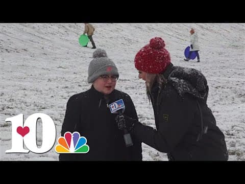 People of all ages sledding at Foothills Mall in Maryvillle