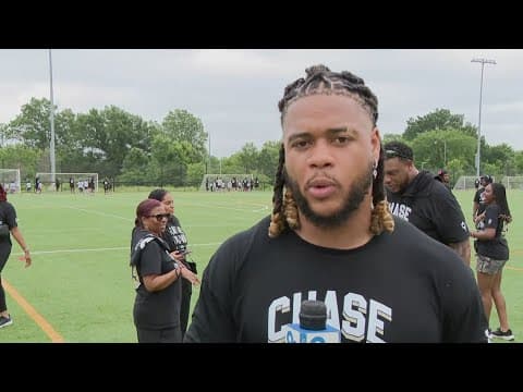 Former Commanders player Chase Young volunteers with young football players