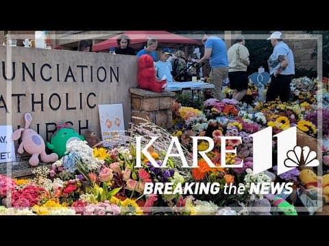 The notes and flowers outside Annunciation Catholic Church