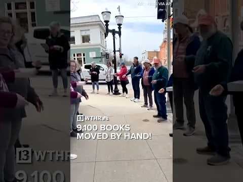 Volunteers move 9,100 books to Michigan store's new location