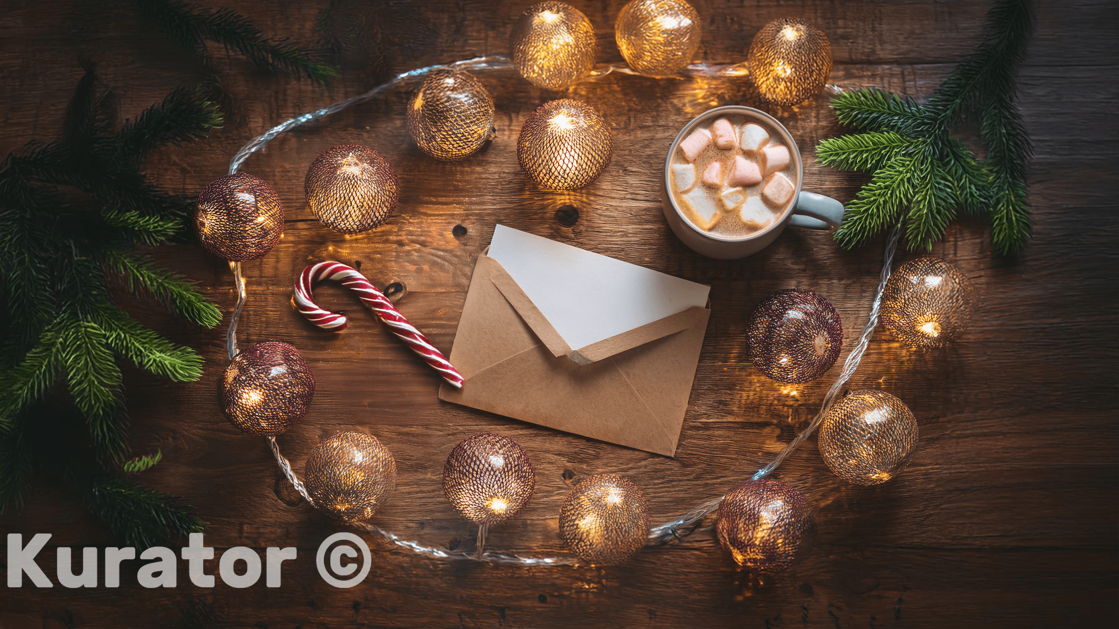 Festive flat lay featuring a holiday letter in an envelope, a candy cane, string lights, and a cup of hot chocolate with marshmallows. The warm wooden background and Christmas decorations create a cozy holiday vibe